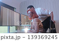 Programmers working at night analyzing code on monitors in a modern office. Software developers collaborating on debugging cybersecurity and data programming projects. Ai coding Software technician. 139369245