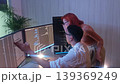 Programmers working at night analyzing code on monitors in a modern office. Software developers collaborating on debugging cybersecurity and data programming projects. Ai coding Software technician. 139369249
