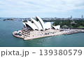 Drone footage of the Sydney Opera House against a blue sky. 139380579