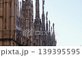 Silhouette statues on top of Duomo at sunny day 139395595