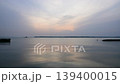 Sunset over Lake Kasumigaura in Ibaraki Prefecture and the calm surface of the lake. 139400015