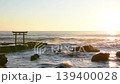 The torii gate at Kamiiso and the sunrise over the sea in Oarai Town, Ibaraki Prefecture. 139400028