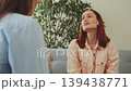 Upset woman crying with tissue during therapy session, showing emotional distress and need for psychological support and counseling 139438771