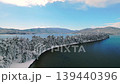 白雪皚皚的天橋立:4K無人機拍攝的日本三大美景之一,松樹與蔚藍大海形成鮮明對比。 白雪皚皚的天橋立:4K無人機拍攝的日本三大美景之一,松樹與蔚藍大海形成鮮明對比。 139440396
