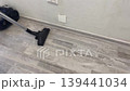 vacuum cleaner humming when vacuuming a floor 139441034