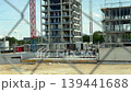 Residential building construction site behind chain link fence 139441688