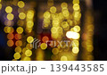 Christmas light bokeh background sets festive mood from first frame, bokeh shimmer paints warm golden glow, bokeh texture ideal for holiday promos, social ads, greeting cards, seasonal branding 139443585