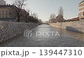 Sarajevo Miljacka river aerial drone rise from water to city skyline 139447310