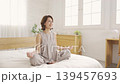 Middle-aged woman, bed yoga 139457693