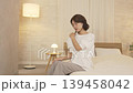 Middle-aged woman, bed, feeling unwell 139458042