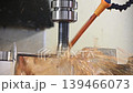 The CNC milling machine rough cutting the mold parts with oil coolant method. The mold and die manufacturing process by CNC machining center. 139466073