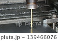 The hole reamer process the metal plate on CNC milling machine. The high precision parts production on CNC milling machine. 139466076