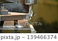 Slow motion scene plunge milling process the metal plate parts on NC milling machine by flat nose end mill tools. The metal working concept on the milling machine. 139466374