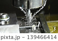 Slow motion close up scene  tapping process the metal plate on CNC milling machine. The high precision parts production on CNC milling machine. 139466414