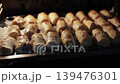 Final Stage of Baking: Golden Meat Crepe Rolls Inside the Oven 139476301