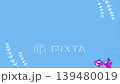 A 15-second looping animation featuring a pink goldfish swimming in a vibrant blue water surface, creating ripples. 139480019