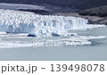Close-up of the ice surface of the Perito Moreno Glacier and pieces of calved ice in the lake water. El Calafate, Santa Cruz, Argentina. Patagonia. Cloudy day.  139498078