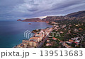 Twilight Town Bathed In Pastel Clouds, Shimmering Bay Lights, Winding Streets And Distant Headland 139513683