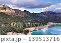 Aerial Cliffside Viewpoint Overlooking Turquoise Reservoir, Adventurer Drone Approach Captures Lofty Precipice 139513716