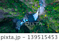 A breathtaking 4K drone aerial video capturing the Fudo Nanaju Falls in Maegawa, Shimokitayama Village, Nara Prefecture, one of Japan's Top 100 Waterfalls, from a bird's-eye view. 139515453
