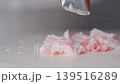 close up of decorating a cake with cream cheese with special kitchen tool. 139516289