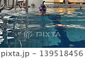 Woman Training in Indoor Swimming Pool Woman Training in Indoor Swimming Pool 139518456
