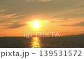 Japanese sunset seascape | Beautiful sunset reflected on the water's surface with island silhouettes 139531572