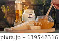 Traditional Israeli cheese and honey highlight local dairy craftsmanship in warm outdoor rural atmosphere. 139542316
