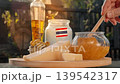 Fresh Thai cheese, honey, and dairy products are displayed in warm rustic light, highlighting local farm traditions. 139542317