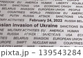 Closeup shot of Russian invasion of Ukraine concept. Sanctions. Military activities. Crisis. Black text on white paper. Camera slowly moving left. Selective focus. 139543284