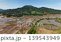 Mount Kakuda in spring, as seen from a rice paddy, is located in Niigata City. 139543949