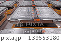 Close-up Tracking Shot of Rows of Lithium-Ion Battery Modules loaded on AGVs inside Fully Automated Modern Autonomous Electric Car Factory. Future Automotive Manufacturing Process. 3d Animation Render 139553180