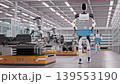 Low Angle View of an AI-powered Humanoid Robot Walking and Carrying Crates with Lithium-Ion Battery Modules in a Fully Automated Car Factory with AGVs and Robotic Arms. 3d Animation Render 139553190