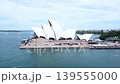 Drone aerial footage of the Sydney Opera House and the surrounding coastal cityscape. 139555000