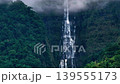 Aerial view misty foggy mountain landscape with clouds and waterfall 139555173