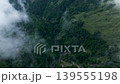 Aerial view misty foggy mountain landscape with clouds 139555198