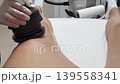 Lymphatic drainage massage on the device in salon 139558341