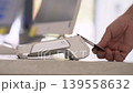 Close up of customer hand making a contactless credit card payment on a white POS terminal in a professional medical clinic or office 139558632
