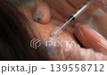 Macro shot of medical needle injection into skin for wrinkle correction or mesotherapy treatment professional cosmetologist performing aesthetic procedure in medical clinic 139558712