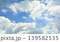 A captivating view of a bright blue sky adorned with fluffy white clouds. This serene atmosphere evokes feelings of peace and tranquility, perfect for outdoor themes. 139582535