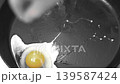 making fried eggs for breakfast 139587424
