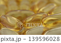 Golden Softgel Capsules Macro Shot with Shallow Depth of Field 139596028