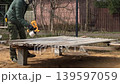 man painting with a spray gun 139597059