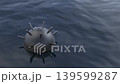 Moored naval mine floating in wavy water 139599287