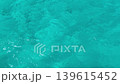 background with blue ripples and waves on the water surface. Waves reflecting light, a swimming pool, sea, ocean. Clear water, splashes, waves, viewed from above. Summer vacation, relaxation, weekend 139615452