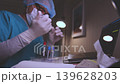 Medical scientist analyzing blood samples in laboratory 139628203