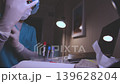 Laboratory scientist preparing blood sample test tubes 139628204