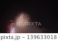 Night Fireworks Display with Blurred Lonely Street Lamp 139633018