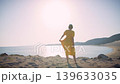 Young Woman Enjoying Sunny Beach and Sea Breeze 139633035