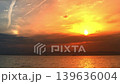 The sea and horizon are bathed in a dramatic sunset. 139636004